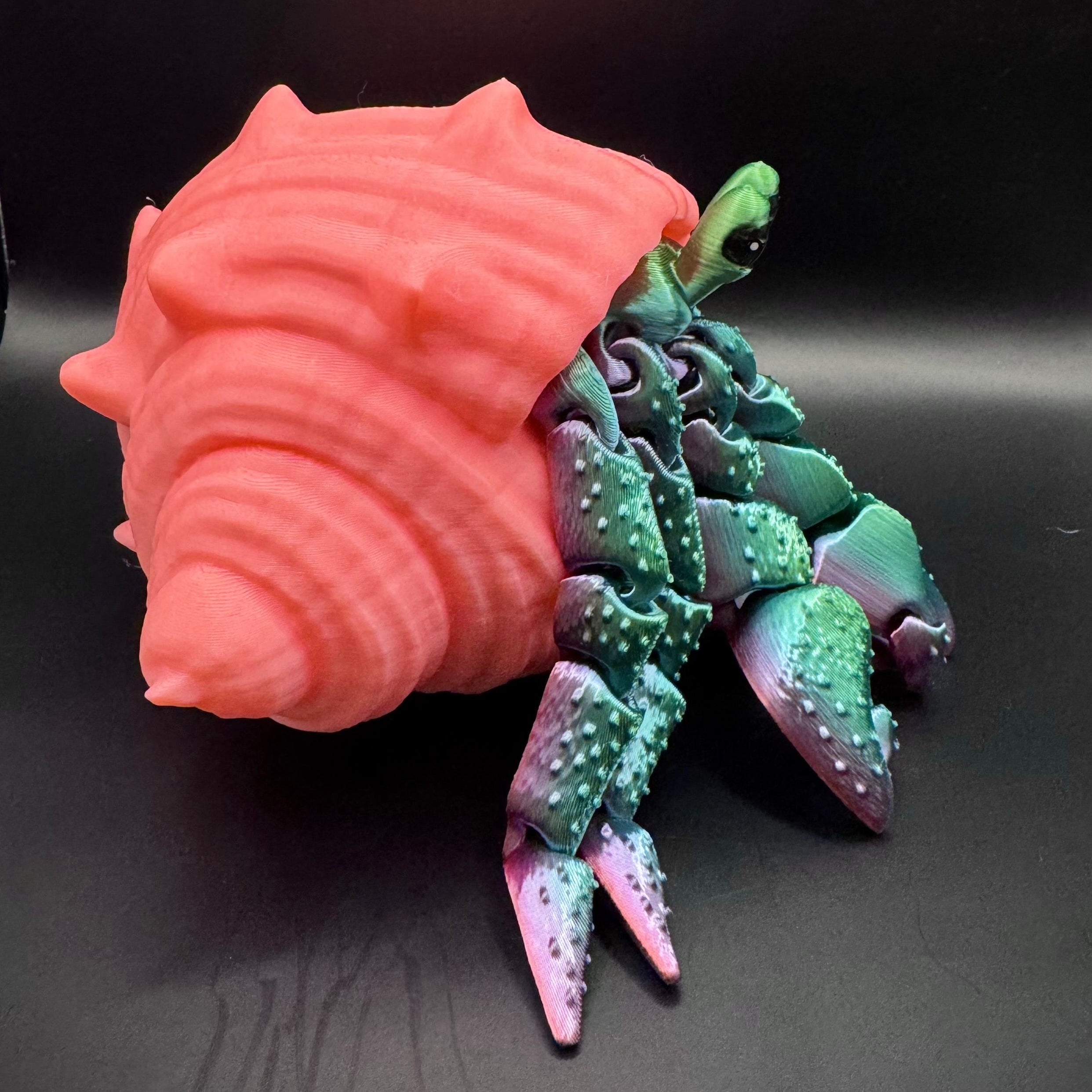 Green and purple ombre 3d printed hermit crab with pink shell 