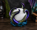 Abyssal Glow octopus statement lamp with hand-painted color-shifting tentacles wrapped around a pearl-shaped globe.