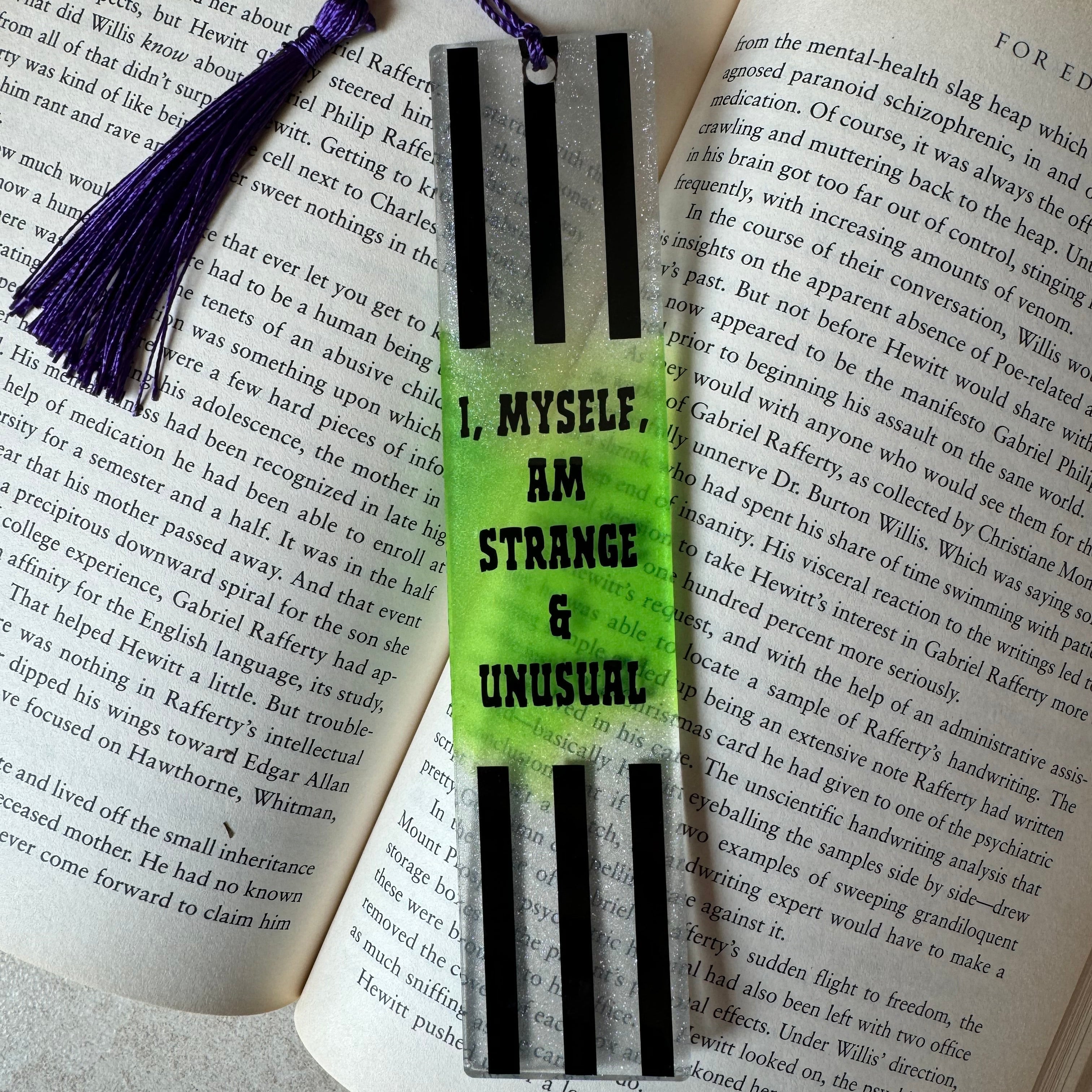Book with a striped bookmark and tassel on an open book
