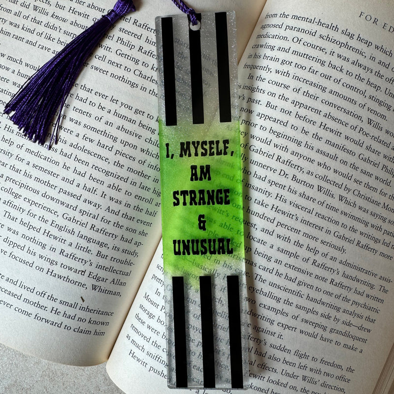 Book with a striped bookmark and tassel on an open book