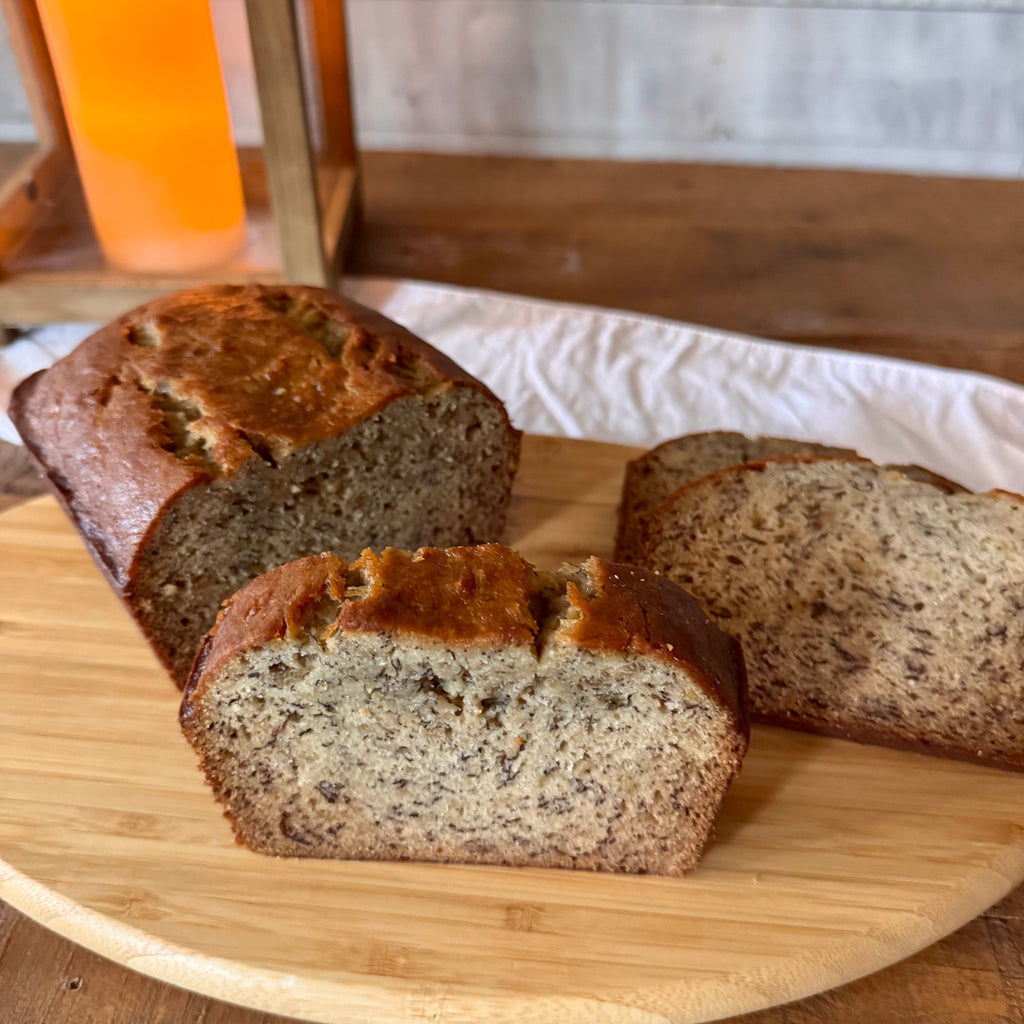 Close-up of a thick slice of classic banana bread showing its tender crumb and moist texture.