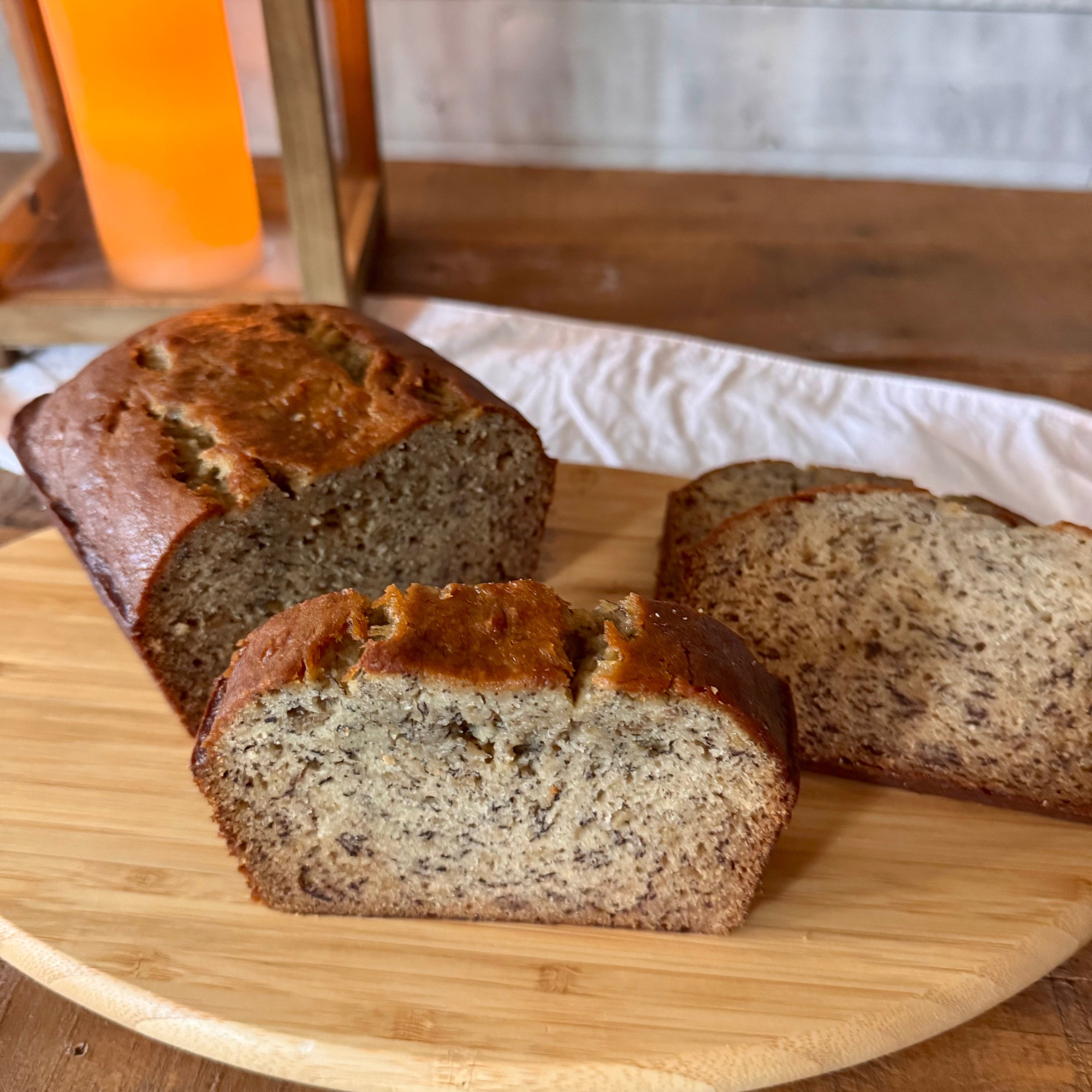 Close-up of a thick slice of classic banana bread showing its tender crumb and moist texture.