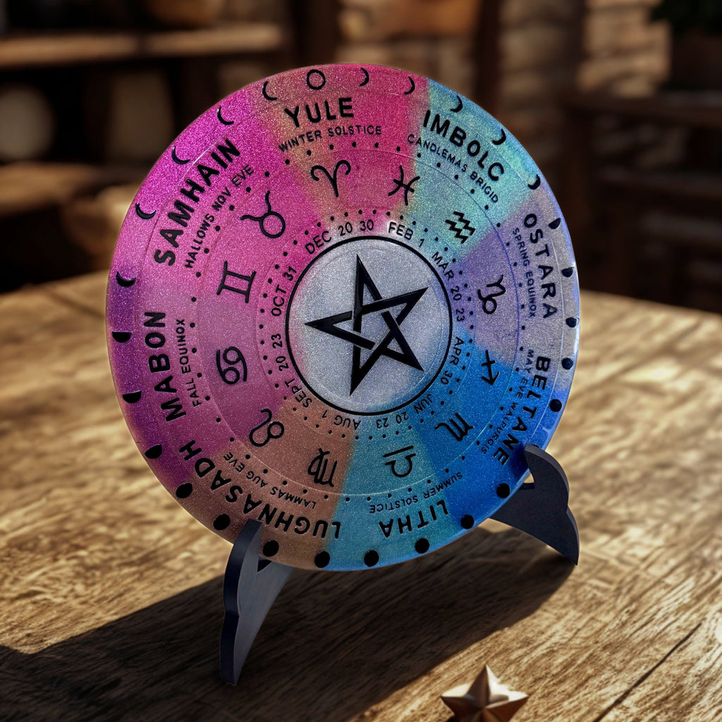 Colorful wheel of the year with star symbol on a wooden surface