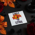 Sticker with skull and floral design surrounded by flowers on a dark surface
