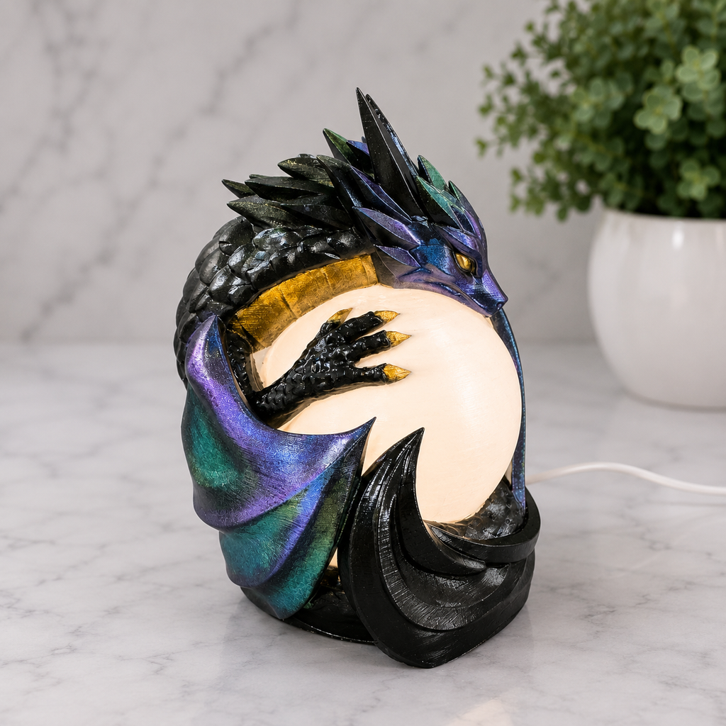 Three-quarter view of the Midnight Sentinel dragon lamp highlighting the sculpted dragon claw and glowing orb