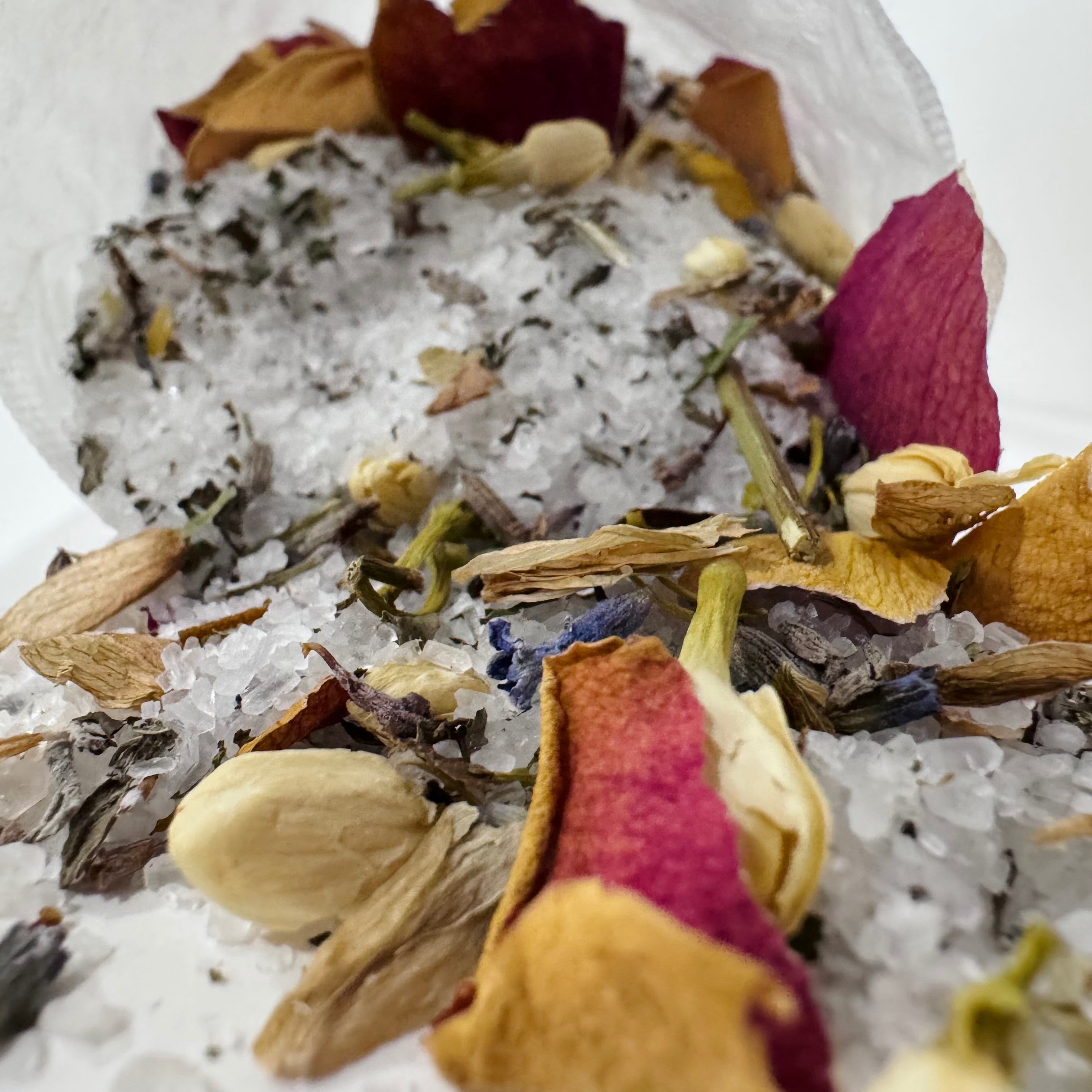 Tea bag with dried herbs and flowers on a white background