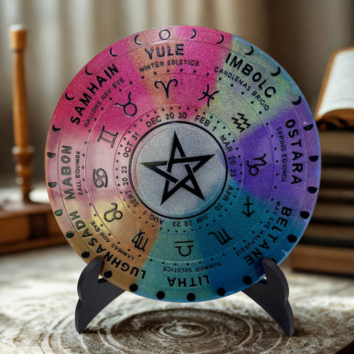 Colorful wheel of the year with astrological symbols on a stand.